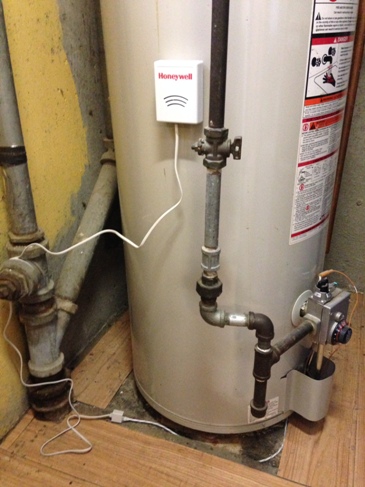 Hot water heater leak detector